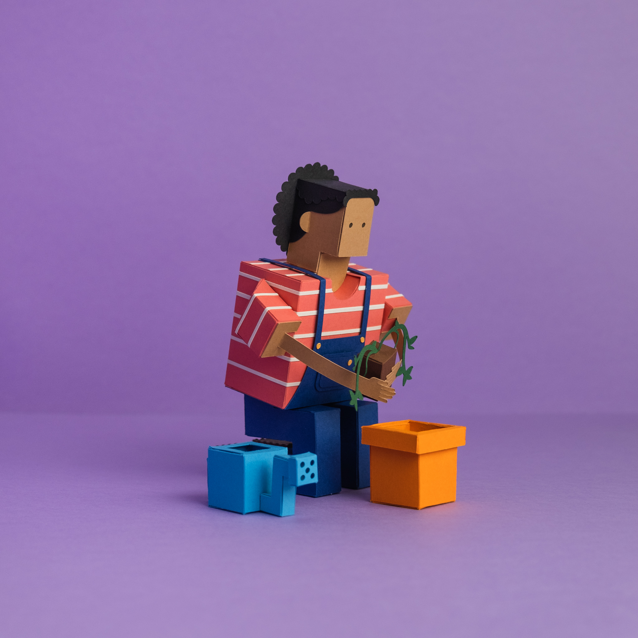 Paper Toy of a person holding a plant