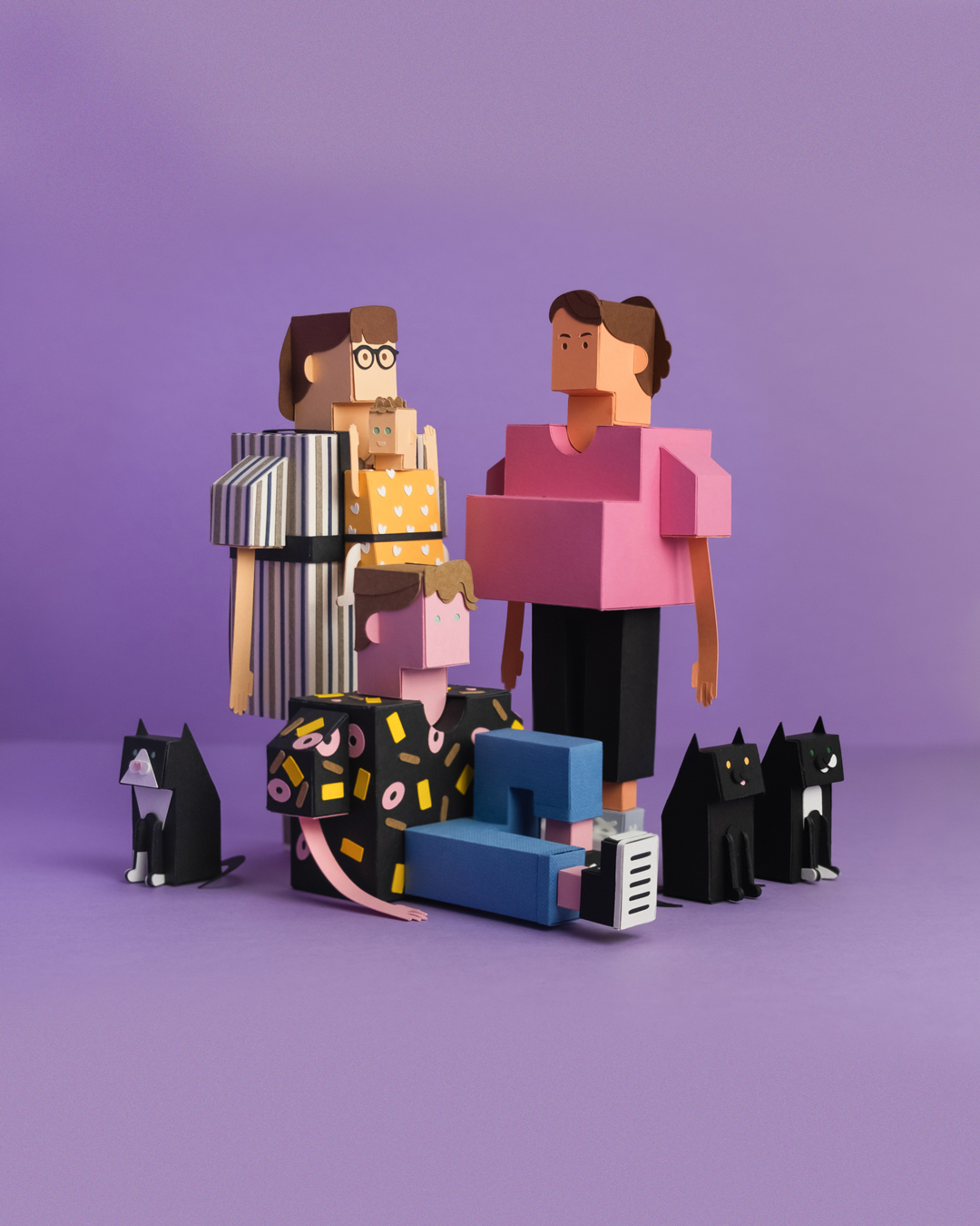 Paper toys of women and cats